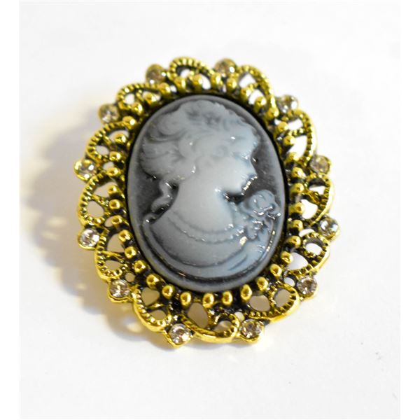 21)  GOLD TONE FILAGREE WITH CLEAR CRYSTAL