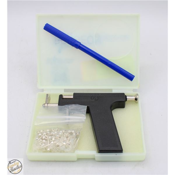 HAND-HELD EAR PIERCING SYSTEM WITH BAG OF