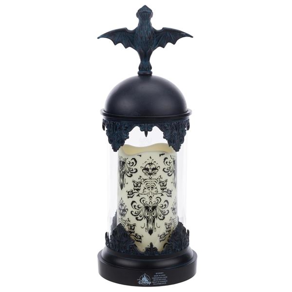 A Haunted Mansion Light-Up Hurricane Candle Set.