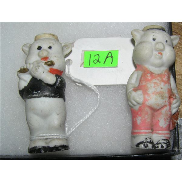 Two of three of the 3 Little Pigs porcelin figures