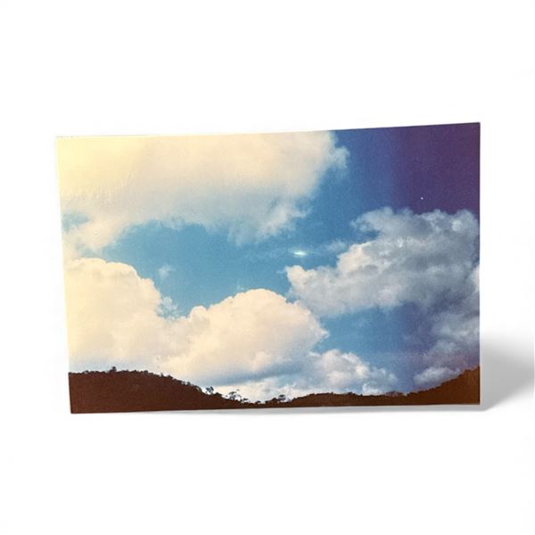 Photograph: UFO in the Clouds - Batorite Cesara Brazil, Oct. 1 1994 - Taken by Paulo Tavola