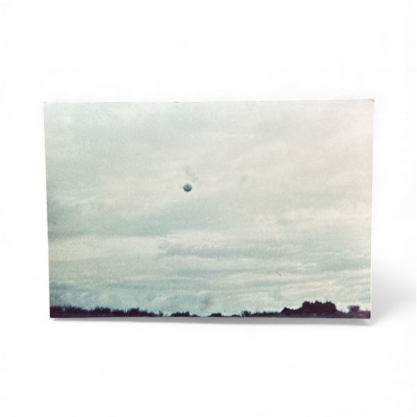 Photograph: UFO in Clouds - Coronel Pringles Argentina, Feb 2 1973 - Taken by Mrs. Alicia Laurraury 
