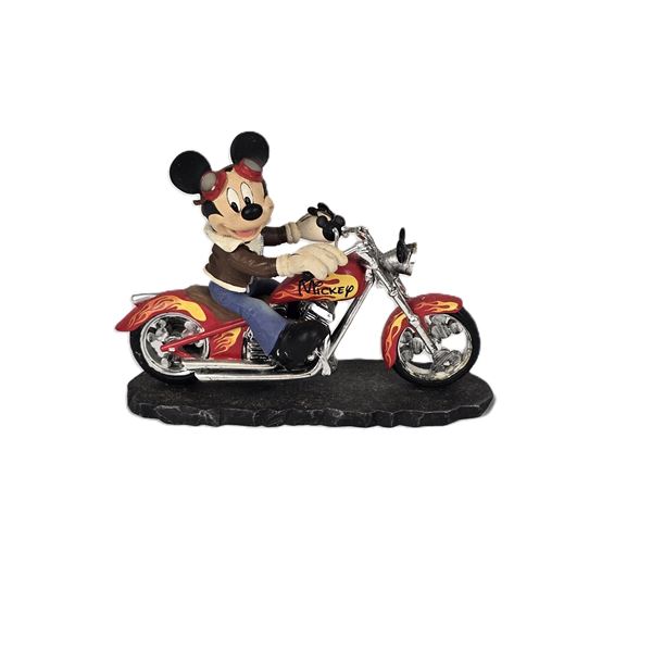 A Mickey Mouse On A Motorcycle Figurine.