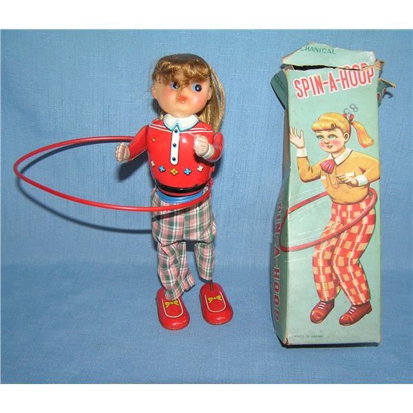 Spin-A-Hoop wind up all tin mechanical toy