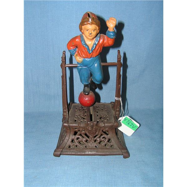 Boy on Trapeze cast iron mechanical bank circa 1950s