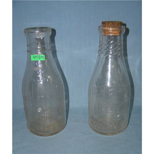 Pair of antique milk bottles includes Bordens and Fred Beers