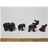 Image 1 : Collection of four hand-carved wooden elephant figurines