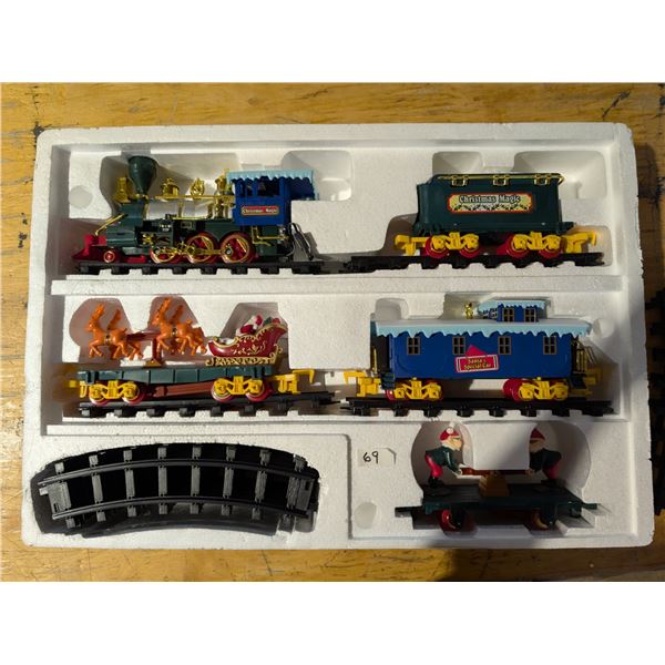 Box of 'Christmas Magic" Trains, Train Carts, Rails. and Etc.