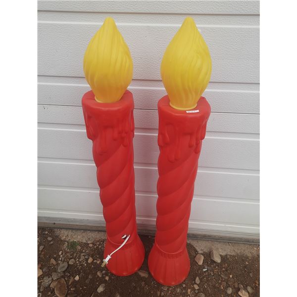 2 Red Plastic Candles.