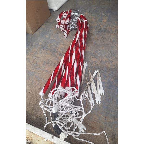 9 Plastic Candy Canes.