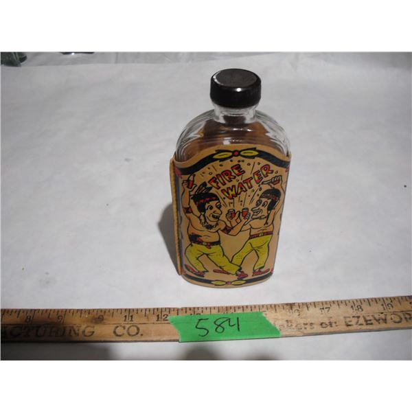 Vintage bottle with fire water leather cover