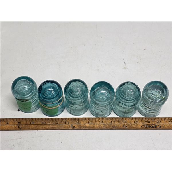 Light blue glass insulators- sizes vary