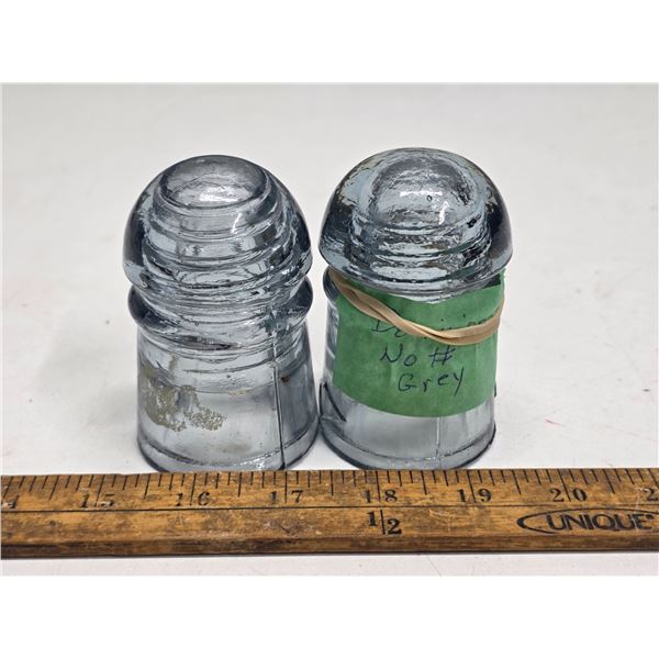 2 grey insulators