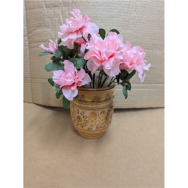Wooden mug hand carved in Ukraine and artificial pink flowers.