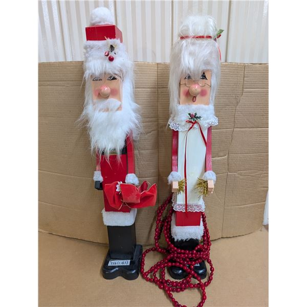 Christmas outdoor wooden decorations: elderly couple.