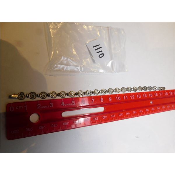 1110.  STERLING SPIRAL LINK BRACELET