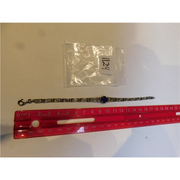 1124.  STERLING BRACELET WITH BLUE CENTER STONE