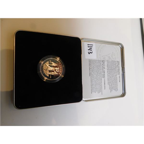 1143.  1999 STERLING SILVER FIFTY CENT PIECE IN TIN GOLF THEME