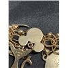 Image 21 : 1345:  14 kt gold bracelet with 28 gold charms, mixture of 12 kt, 14 kt and unknown charms. Weight: 