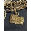 Image 30 : 1345:  14 kt gold bracelet with 28 gold charms, mixture of 12 kt, 14 kt and unknown charms. Weight: 