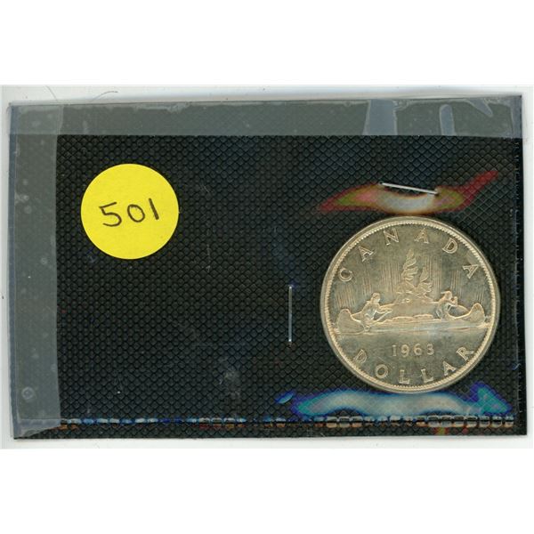 1963  Canadian Dollar. Indian and Voyageur in Canoe.