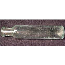 SMALL ANTIQUE BOTTLE - ELIXIR OF OPIUM - EMBOSSED 