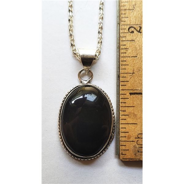 19)  BEZEL SET OVAL BLACK ONYX PENDANT ON