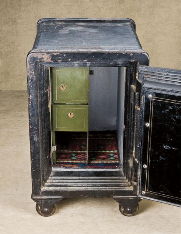 Old iron floor safe approx. 11” wide, 131/2” deep and 14” high on iron