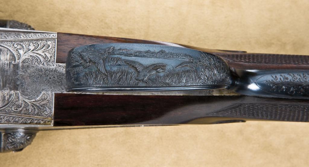 Ornately engraved and high relief chiseled Boss Side lock Shotgun with ...