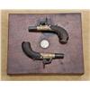 Image 2 : Diminutive pair of percussion muff pistols signed “R. Bragg, London” in original to the period case 