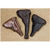 Image 1 : Lot of three German military holsters including a leather holster for an Artillery Luger in overall 