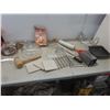 Image 1 : Kitchenware Lot — Cookie Press, Glass Cake Lid, Trivets, Marble Rolling Pin, Grater and More.