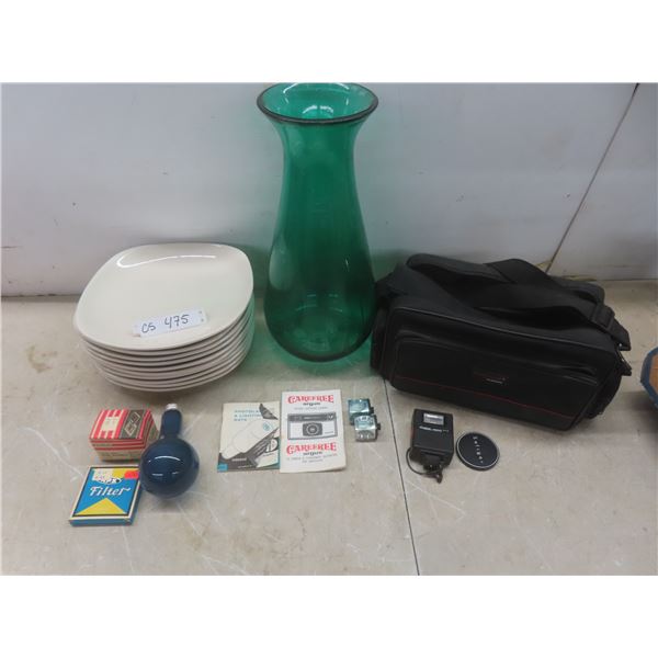 10 Plates, A Glass Vase, And A Camera Bag.