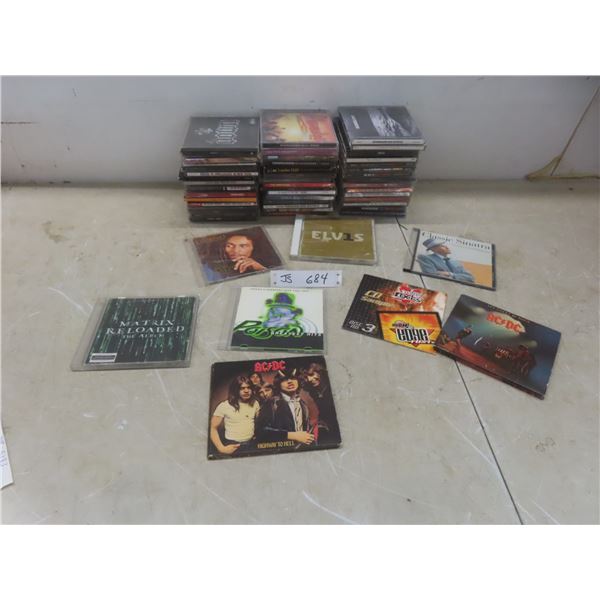 50+ Music CDs - Examples Include AC/DC, Nirvana, Eagles, And Elvis.