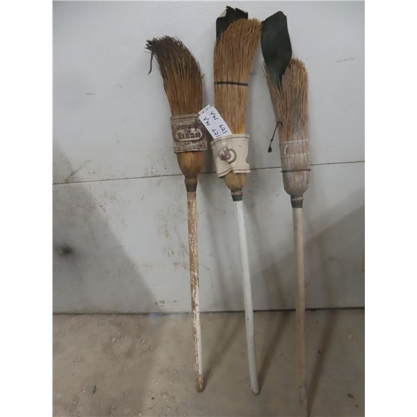 3 Curling Brooms.