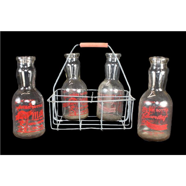 Four 1 Quart Advertisement Milk Bottles With Wire Carrier