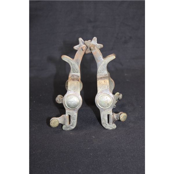 Unmarked Overlaid Spurs- 1.2" Bands- 2" Shanks- 1" 5 Point Rowels- Chap Guards- Swinging Buttons- Mi