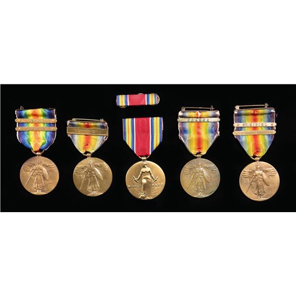 4 WWI US VICTORY MEDALS AND 1 WWII EXAMPLE.