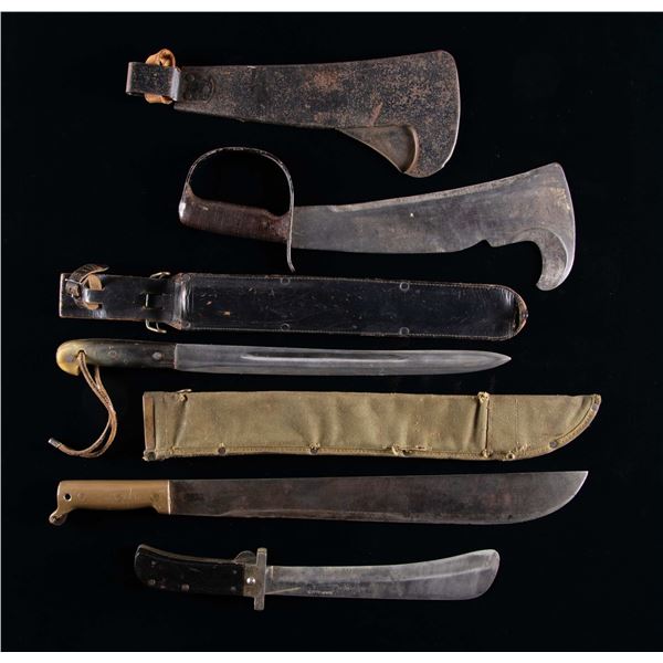 FOUR MILITARY MACHETES.
