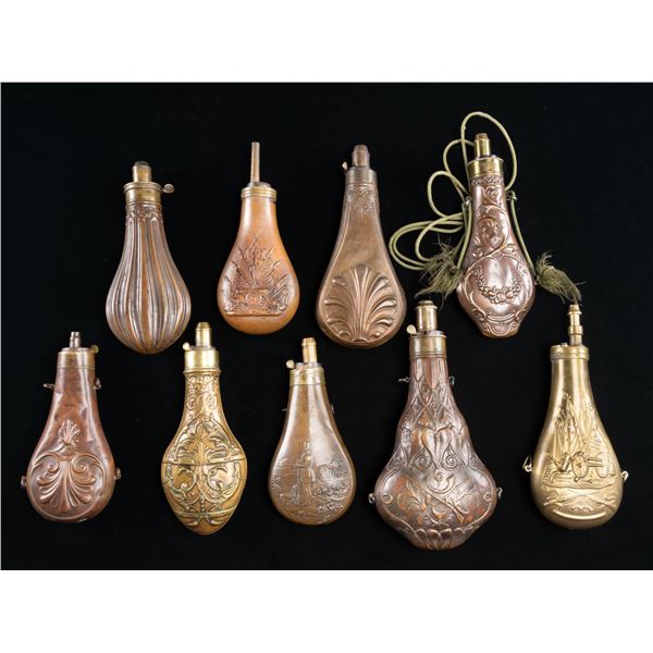 9 BRASS AND COPPER POWDER FLASKS WITH CHARGERS.