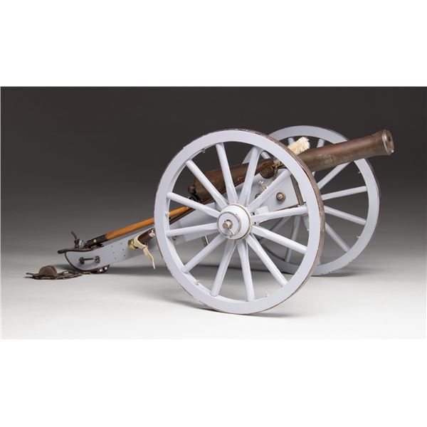 MINIATURE BRASS CANNON WITH CARRIAGE.