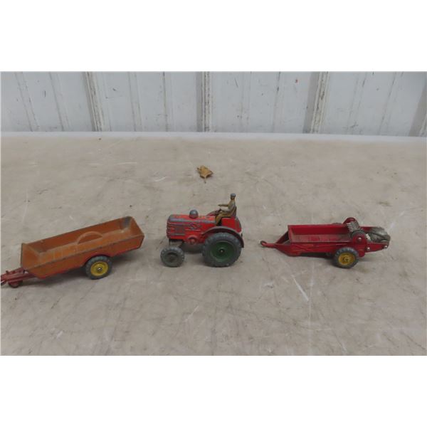 Three Dinky Farm Implements: Case Tractor #301 (3"), MH Manure Spreader (4 1/2"), and Farm Trailer