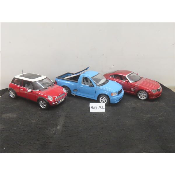 3 Die Cast Cars - Maisto 1/18 Scale Mini Cooper, 2003 Crossfire, and Ford SVT F-150