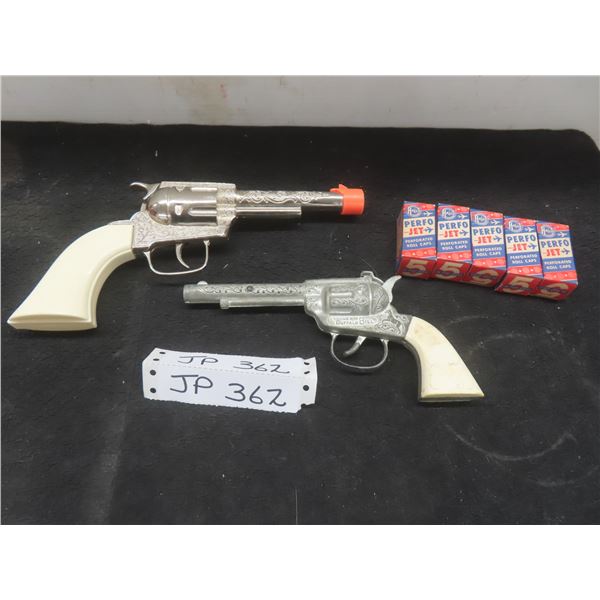 Two Cap Guns (One New) and Five Boxes of Caps