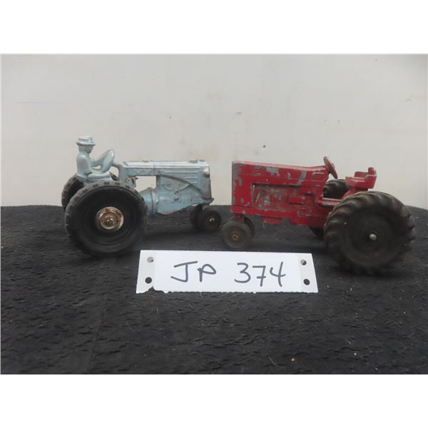 Two Farm Tractors: Ertl (3" x 5" x 3 1/4") and MM (3 1/2" x 5 1/2" x 3 1/4")