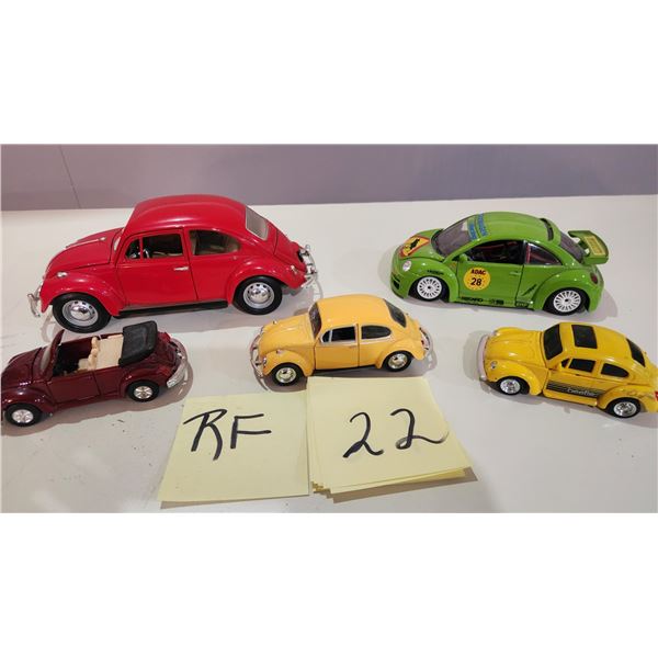 5 Volkswagen Beetles - Largest is 1957 Beetle 1/24, 1999 BBurago, 2 Small, Transformer Beetle.