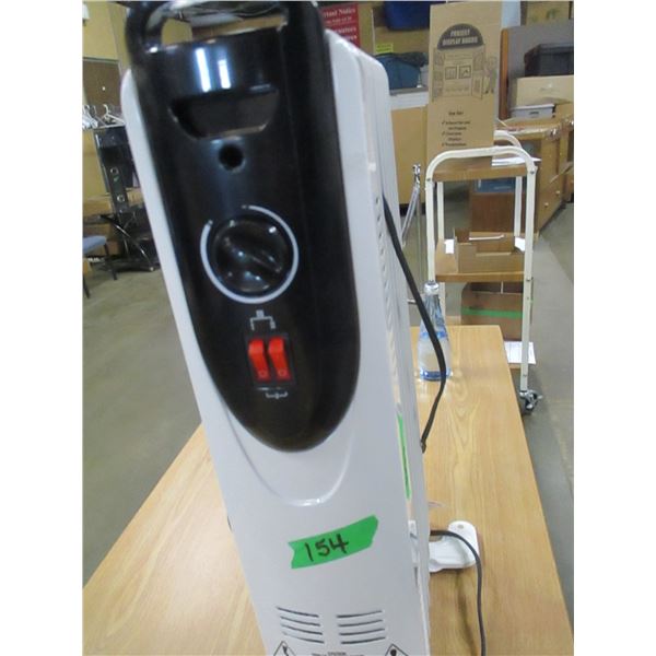 FREIGHT DAMAGE (AS IS):  5 FIN ELECTRIC OIL H EATER