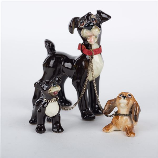 A Tramp with Puppies Ceramic Figurine Set by Goebel.