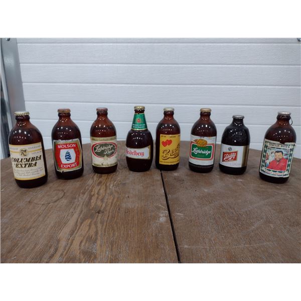 8 full/sealed stubby beer bottles