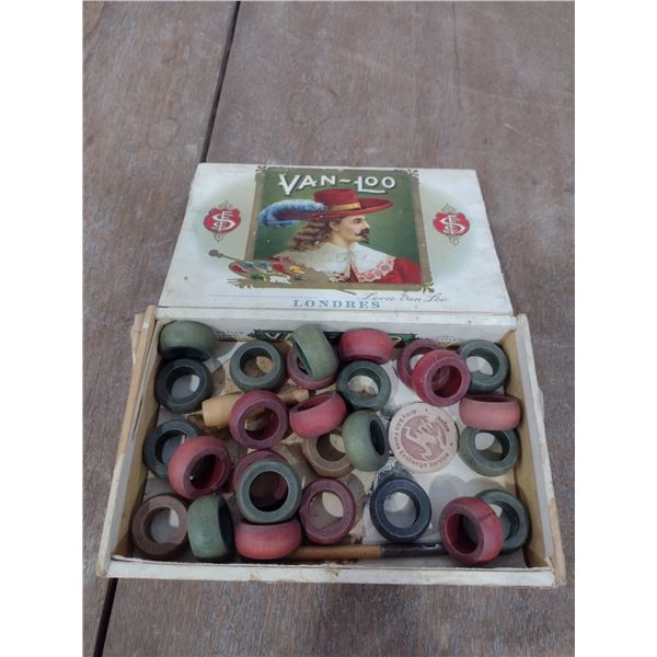 Wooden Crokinole game pieces in old cigar box